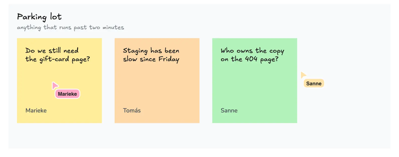 A parking lot area with three sticky notes in different colours, each signed with the name of the person who wrote it